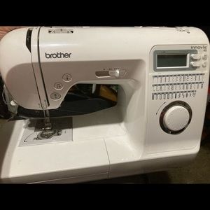 Sewing machine with pull behind carry bag